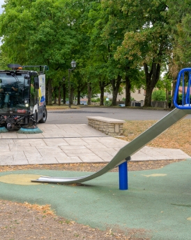 RAVO E2 sweeping in a playground.