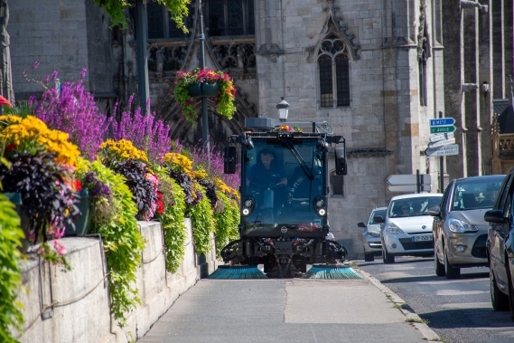 E2 sweeping the pavement over a bridge.