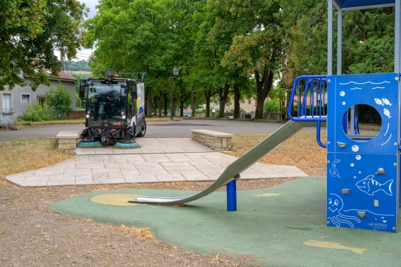 RAVO E2 sweeping in a playground.
